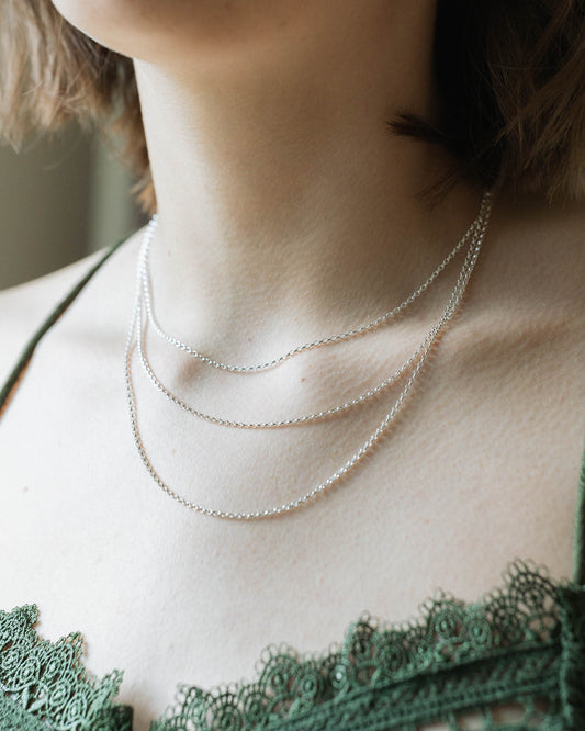 16", 18" and 20" silver chains layered