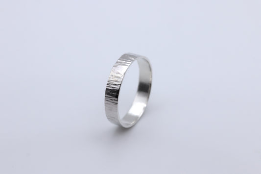 A hammered bark texture silver ring